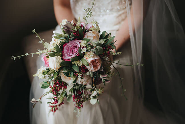 bride holding flowers